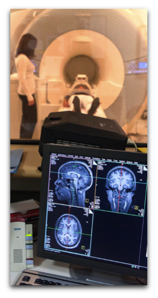 Hedy watching a subject going into MRI machine 